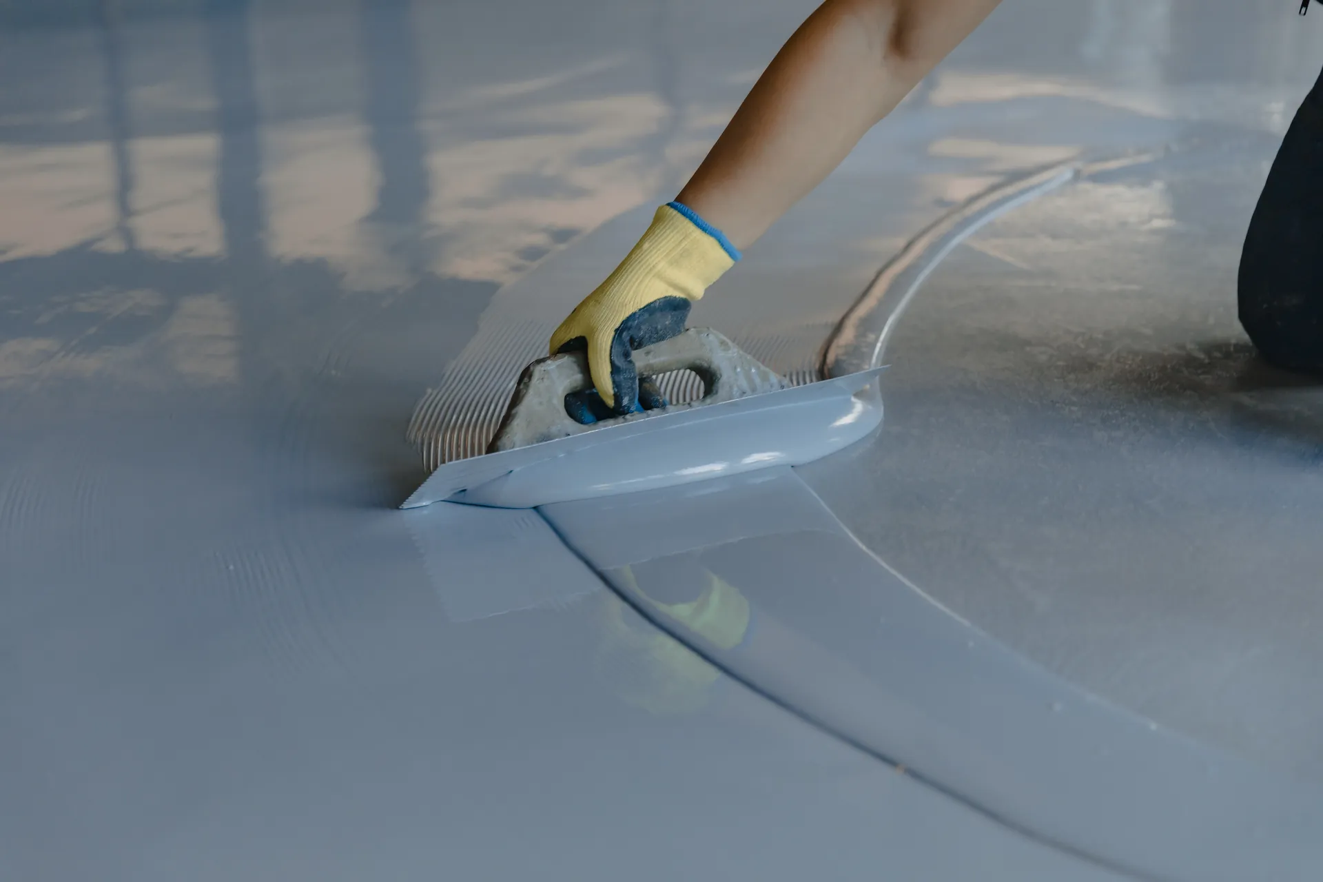 Installer troweling a flake epoxy floor