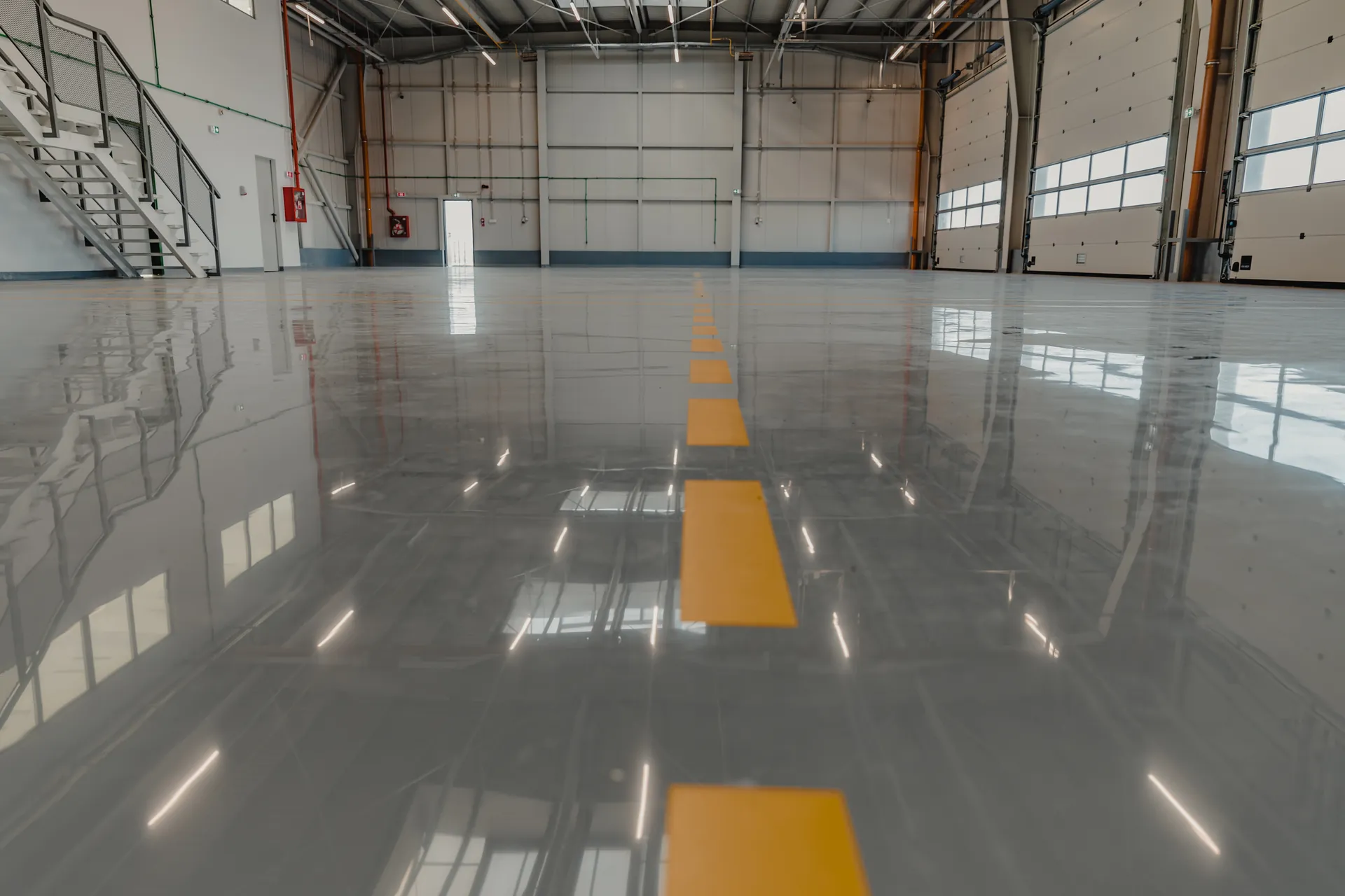 Coated industrial floor with safety lines